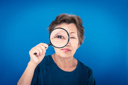 elderly woman blue backgroundの写真素材