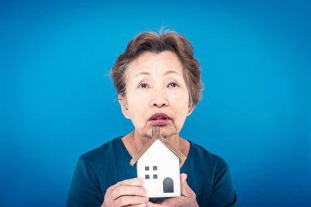 elderly woman blue backgroundの写真素材