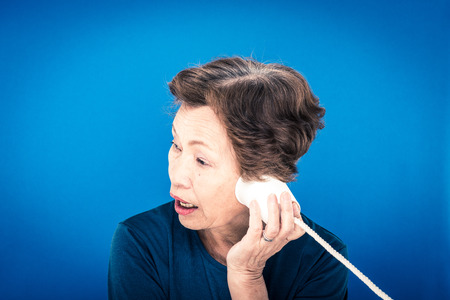 elderly woman blue backgroundの写真素材