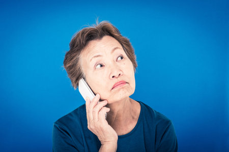 elderly woman blue background