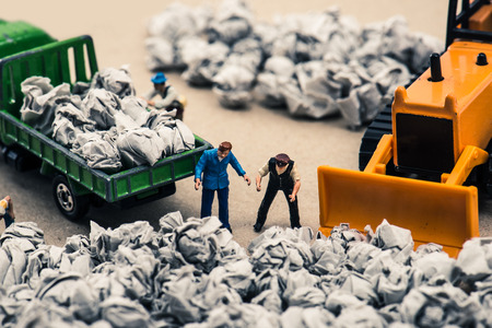 Garbage and miniature dollsの写真素材