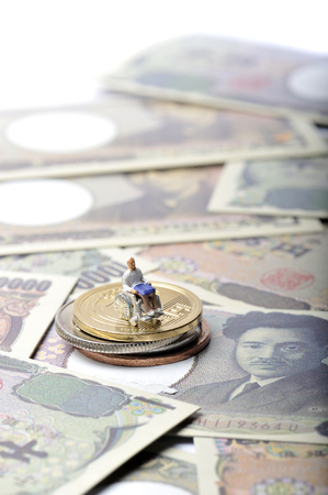 Miniature human with wheelchairの写真素材