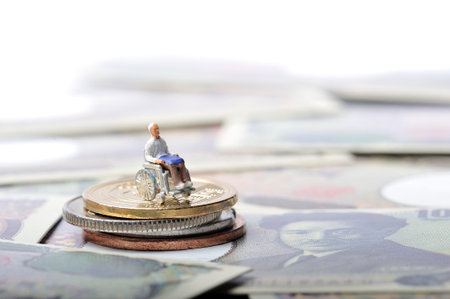 Miniature human with wheelchairの写真素材