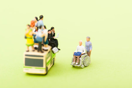 Miniature human with wheelchairの写真素材