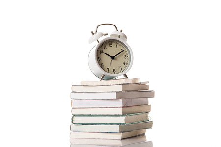 Stacked books and watchesの写真素材