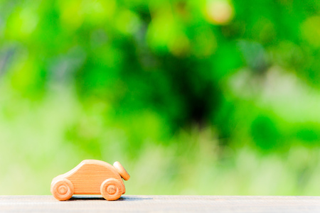 Toy car and green blur backgroundの写真素材