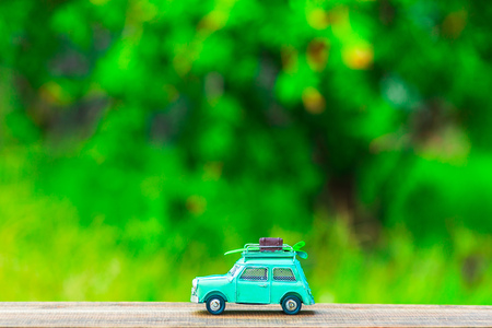 Toy car and green blur backgroundの写真素材