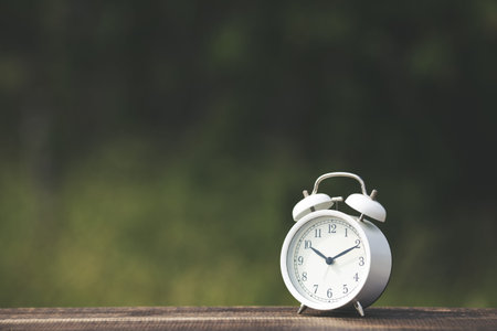 Alarm clock and green blur background