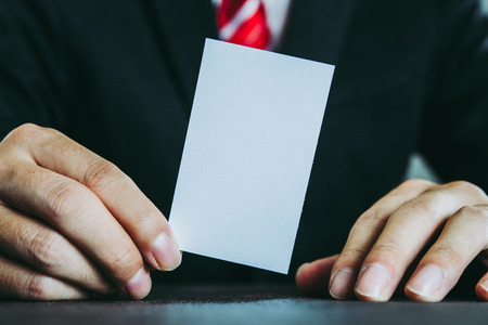 Businessman holding an empty business cardの写真素材