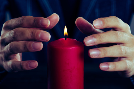 red candle and a manの写真素材