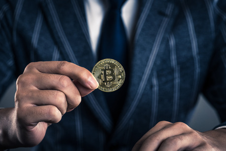 businessman with a bit coinの写真素材