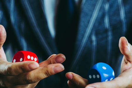 businessman holding a diceの写真素材