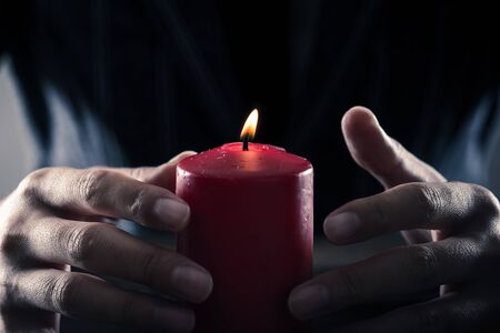 red candle and a manの写真素材