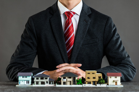 Businessman selling housesの写真素材