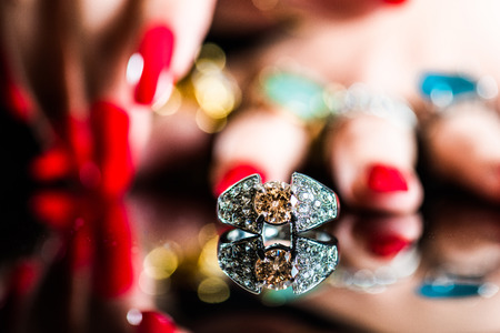 Women's hand with lots of  jewelry ringsの写真素材