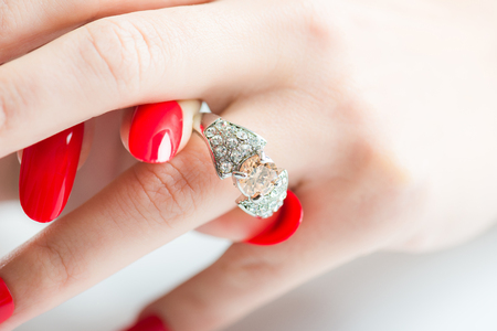 Women's hand with jewelry ringsの写真素材