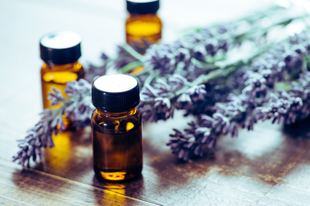 Aromatherapy tools, bottles with oil and lavender flowersの写真素材