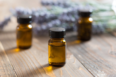 Aromatherapy tools, bottles with oil and lavender flowersの写真素材