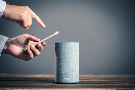 Smart speaker and male handの写真素材