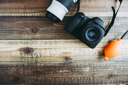 Digital camera on wooden tableの写真素材