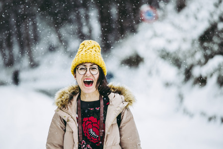 Snowy landscape and Asian womanの写真素材