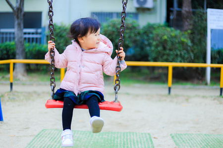 asian cute children playing outdoorの写真素材