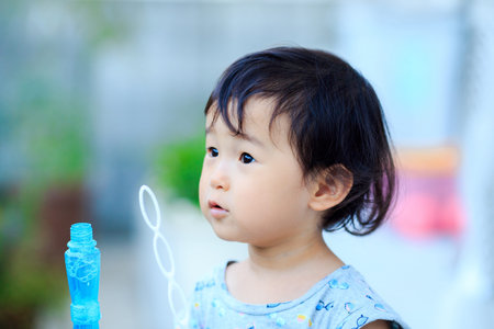 Children playing outdoorsの写真素材