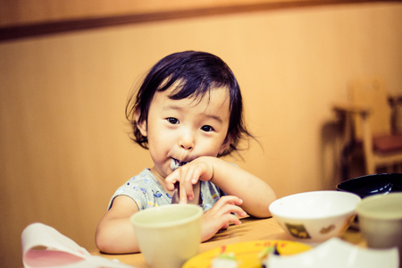 Cute baby with a mealの写真素材