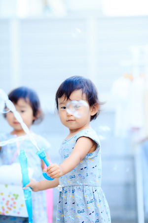 Children playing outdoorsの写真素材