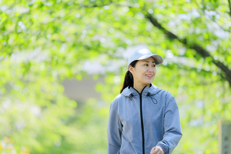 Asian women with green blurの写真素材