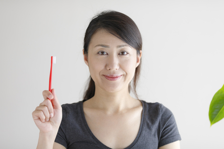 Asian women with toothbrushの写真素材