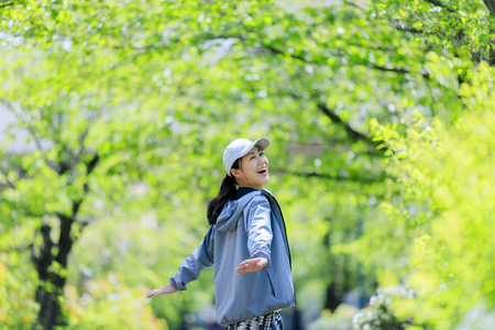 Asian women with green blurの写真素材