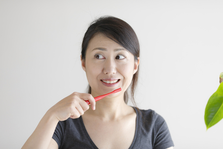 Asian women with toothbrushの写真素材