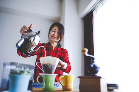 Asian women making coffeeの写真素材