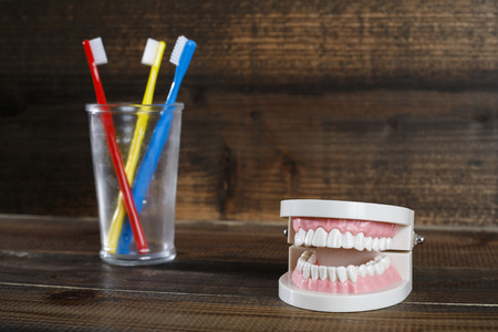 Wooden table and toothbrushの写真素材