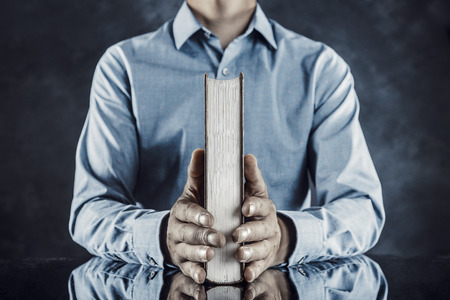 Heavy books and businessmenの写真素材