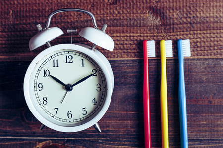 Wooden table and toothbrushの写真素材