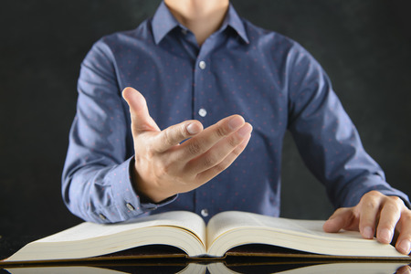 Heavy books and businessmenの写真素材