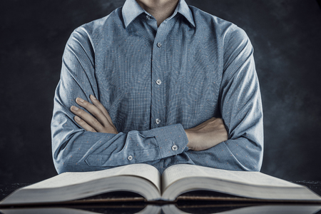 Heavy books and businessmenの写真素材