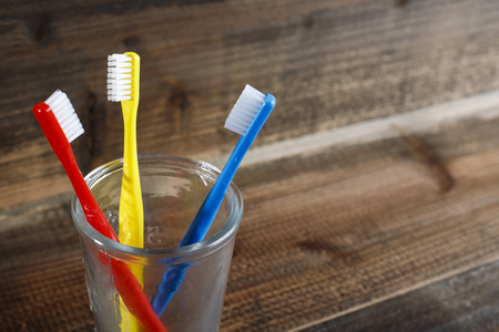 Wooden table and toothbrushの写真素材