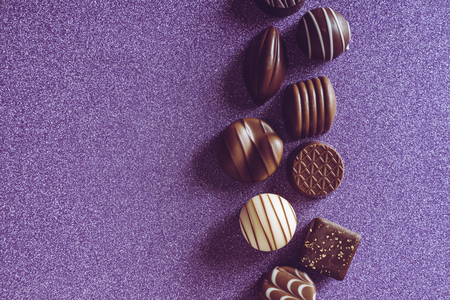 Multiple chocolate purple backgroundの写真素材