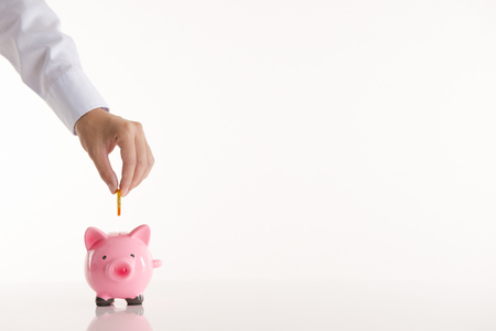 Pink piggy bank with white backgroundの写真素材