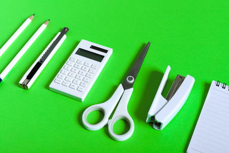 Stationery on green paperの写真素材