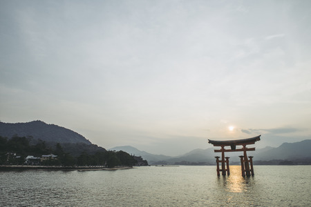 Hiroshima,Japan - July 25,2018 - Miyajima is a small island of Hiroshima in Japan. It is most famous for its giant torii gate, which at high tide seems to float on the water.のeditorial素材