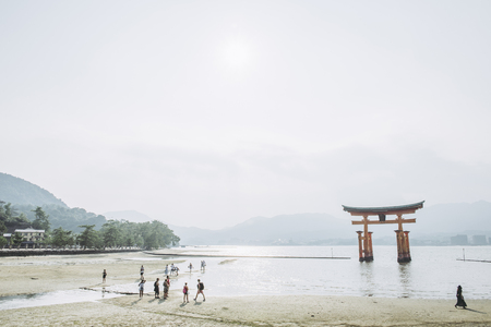 Hiroshima,Japan - July 25,2018 - Miyajima is a small island of Hiroshima in Japan. It is most famous for its giant torii gate, which at high tide seems to float on the water.のeditorial素材