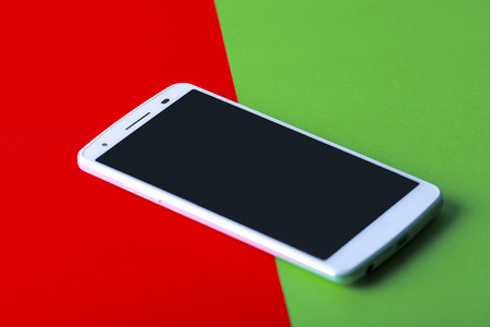 Smartphone with a colorful backgroundの写真素材