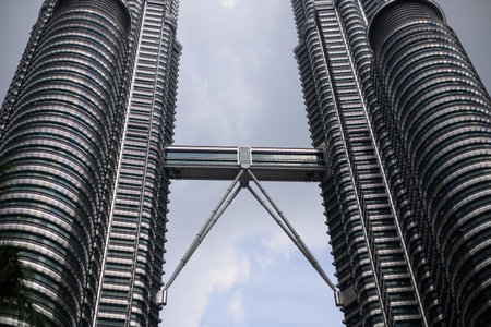 Kuala Lumpur, Malaysia -  May 14,2018 - Petronas Towers and KLCC.Petronas Towers is a high-rise...