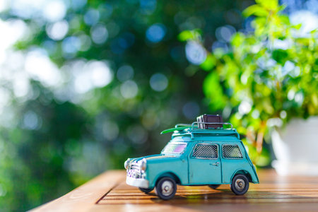 Green blur background and toy car