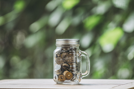 Coins and glass cupsの写真素材