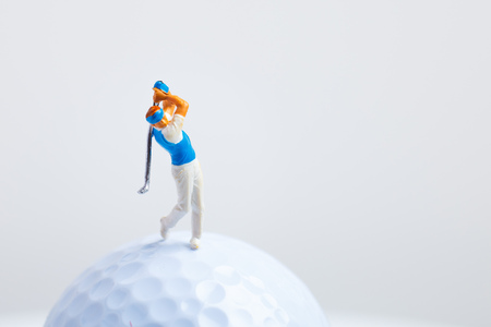 Miniature figures and golf ballsの写真素材